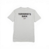 Back view of sand-colored t‑shirt with “TERRORISTS SUCK” text and small logo below