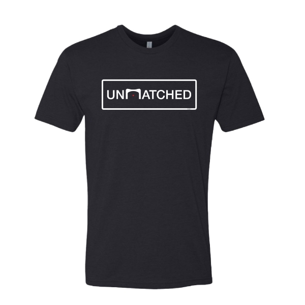 Front view of black Trijicon UNMATCHED Tee with UNMATCHED graphic